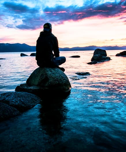 meditation and mindful man on the rock